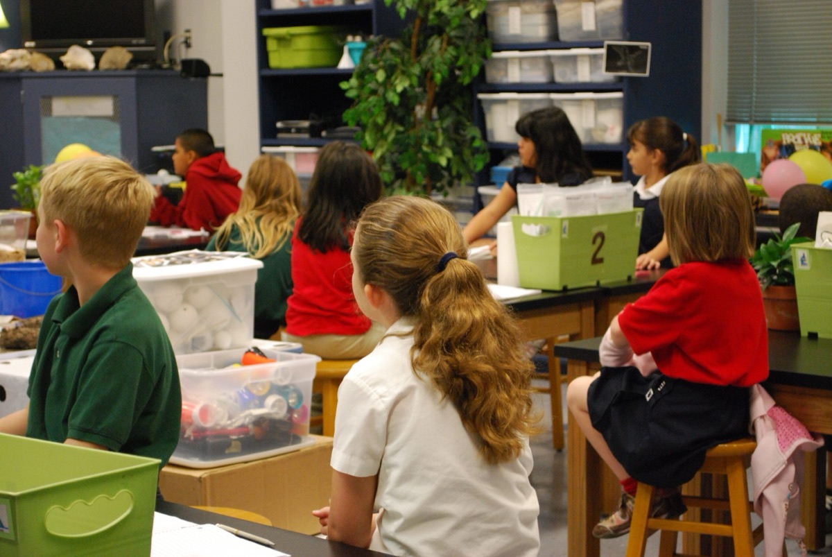 Students at lab tables in a science classroom